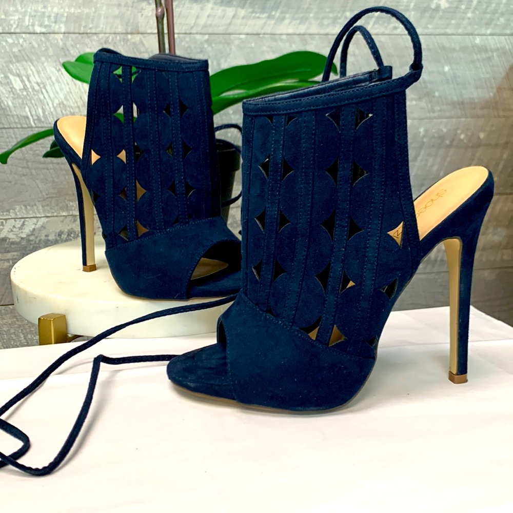 Blue wrap around heels. Size 7 | 5 inch heels.